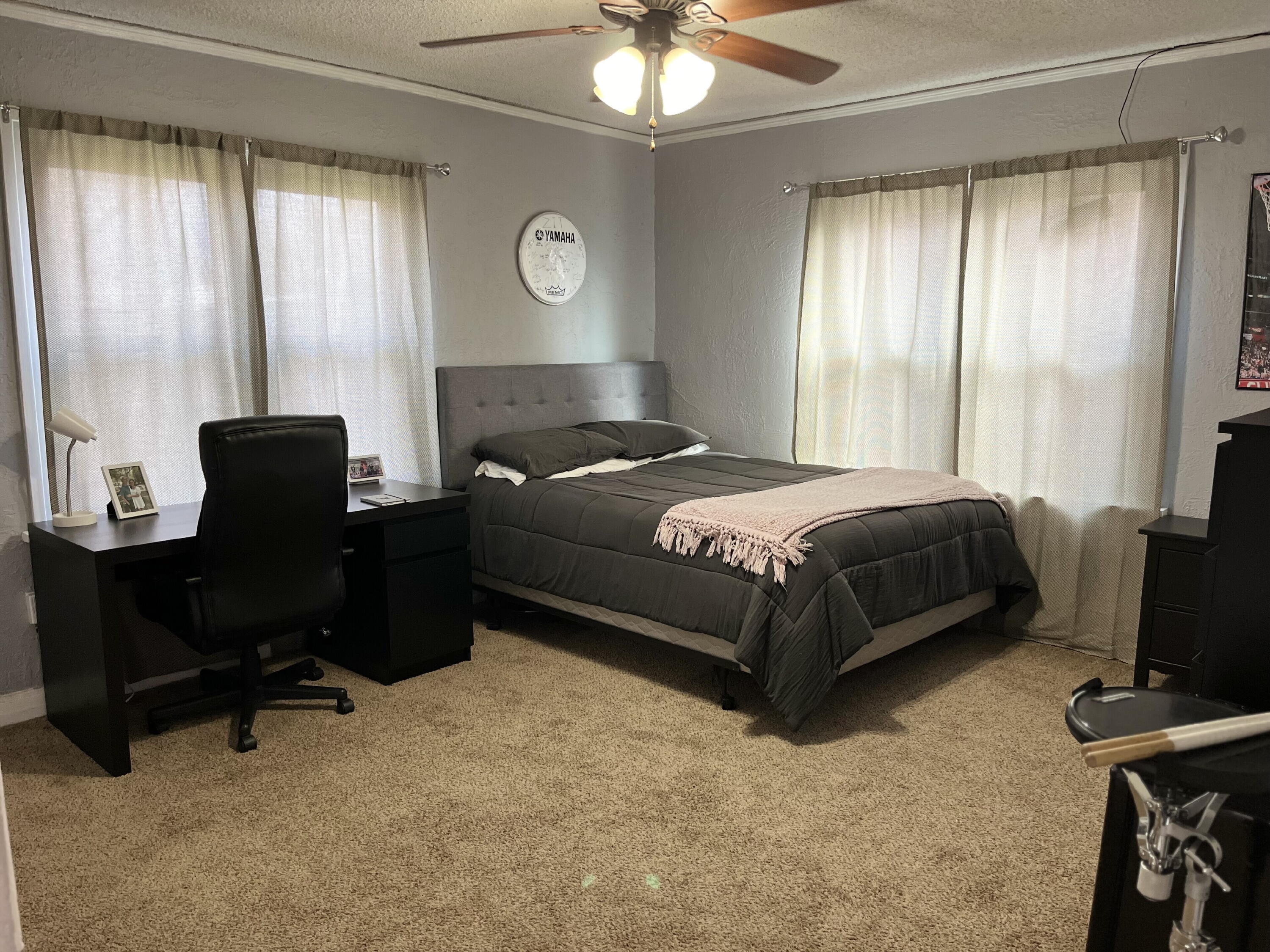 1724 28th Street Lubbock, TX 79411 - Photo 13 of 26 a bedroom with a bed and a window