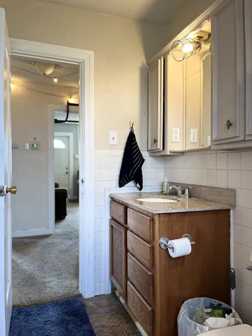 a bedroom with a bed window and a desk