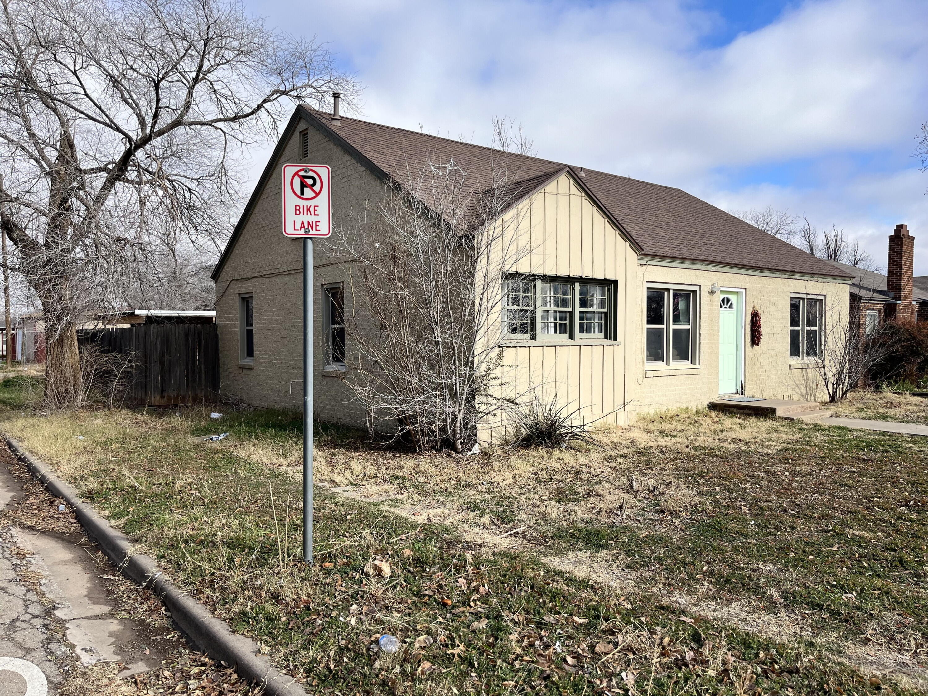 1724 28th Street Lubbock, TX 79411 - Photo 2 of 26 a front view of a house with a yard