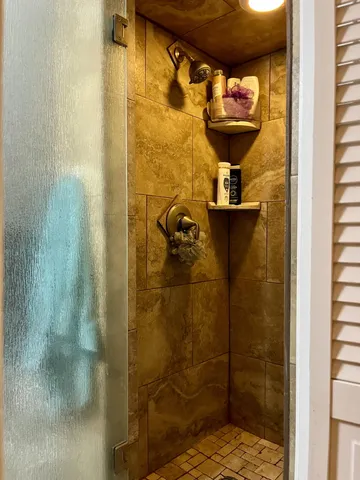 a bathroom with a sink vanity and a mirror