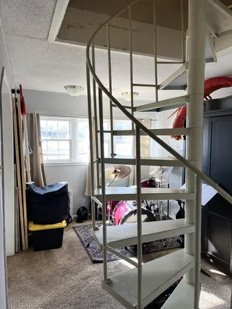 a bedroom with a bed and dresser