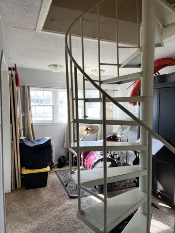 a bedroom with a bed and dresser