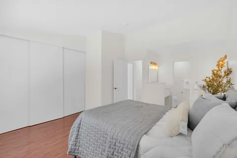 a bedroom with a bed and a closet