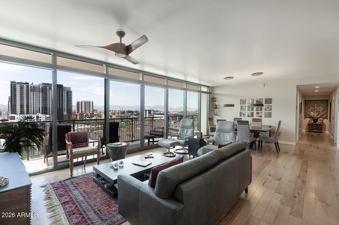200 West Portland Street, Unit 1113 Phoenix, AZ 85003 - Photo 11 of 85 a living room with furniture and floor to ceiling windows