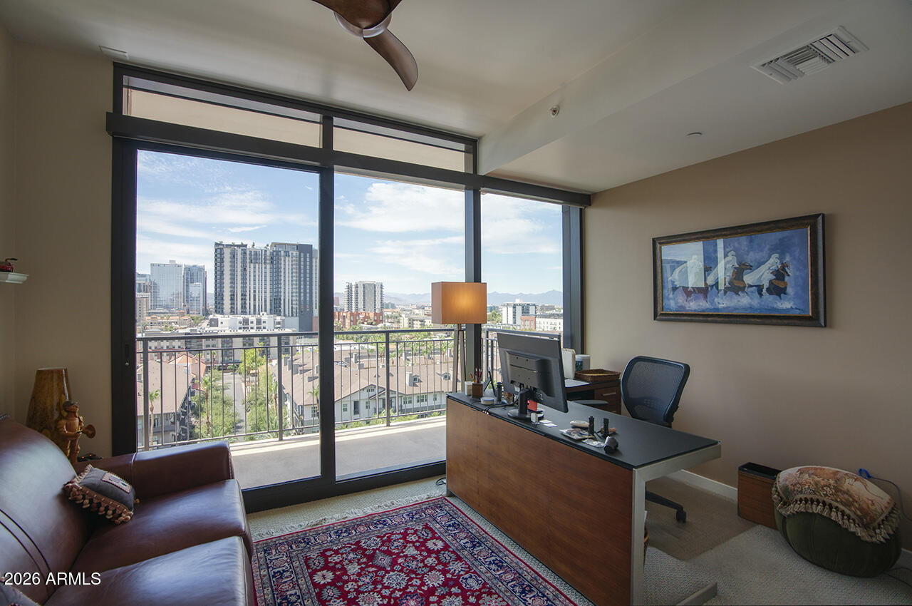 200 West Portland Street, Unit 1113 Phoenix, AZ 85003 - Photo 23 of 85 a living room with furniture and a floor to ceiling window