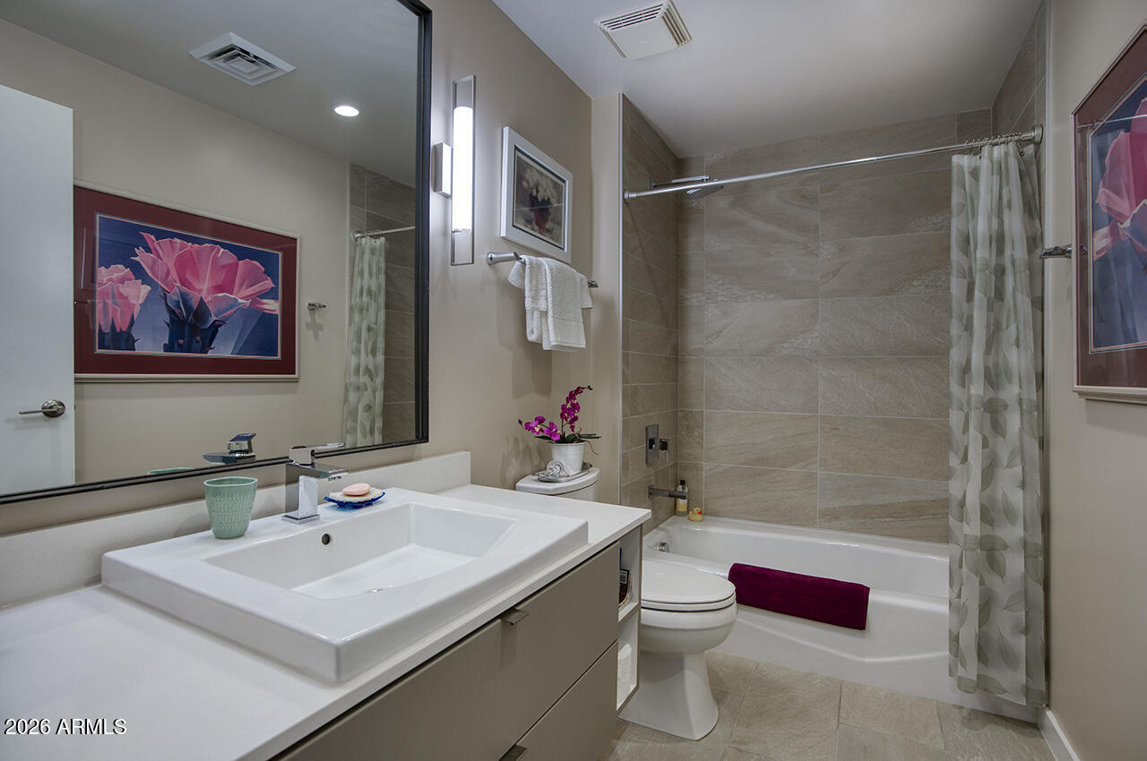 200 West Portland Street, Unit 1113 Phoenix, AZ 85003 - Photo 27 of 85 a bathroom with a sink mirror vanity and toilet