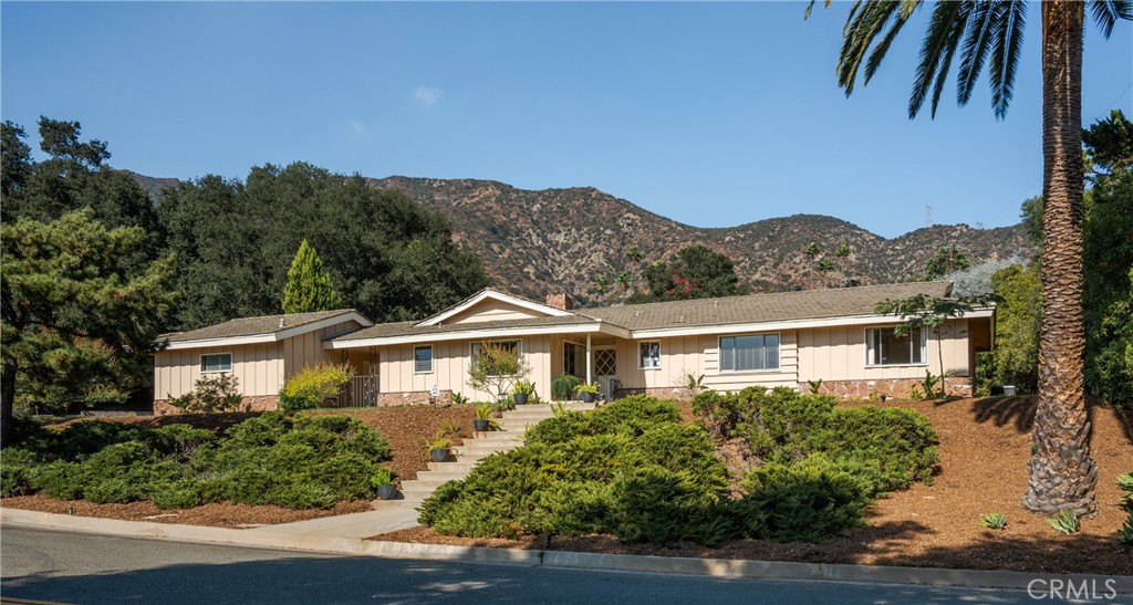 152 Spinks Canyon Road Duarte, CA 91010 - Photo 1 of 1 a front view of a house with a yard and potted plants