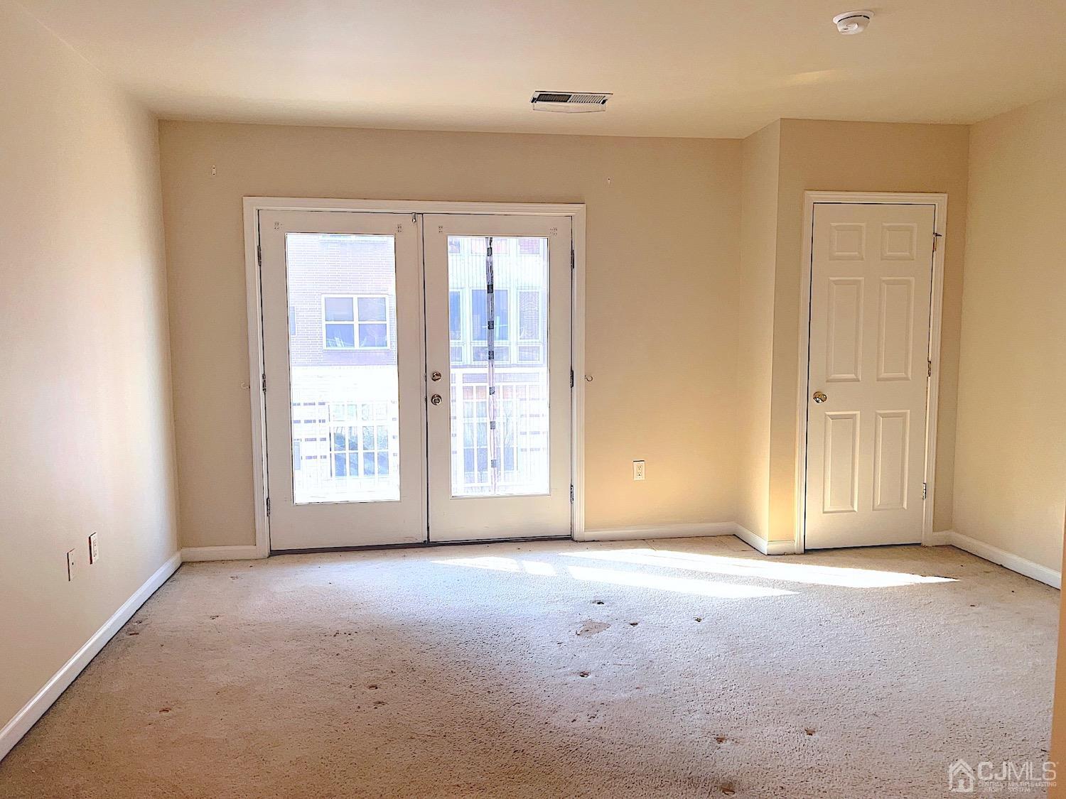 368 Rector Street, Unit 317 Perth Amboy, NJ 08861 - Photo 12 of 25 Master bedroom: Spacious bedroom With double closets access to balcony and master bath. W/w carpeting 6 panel doors.