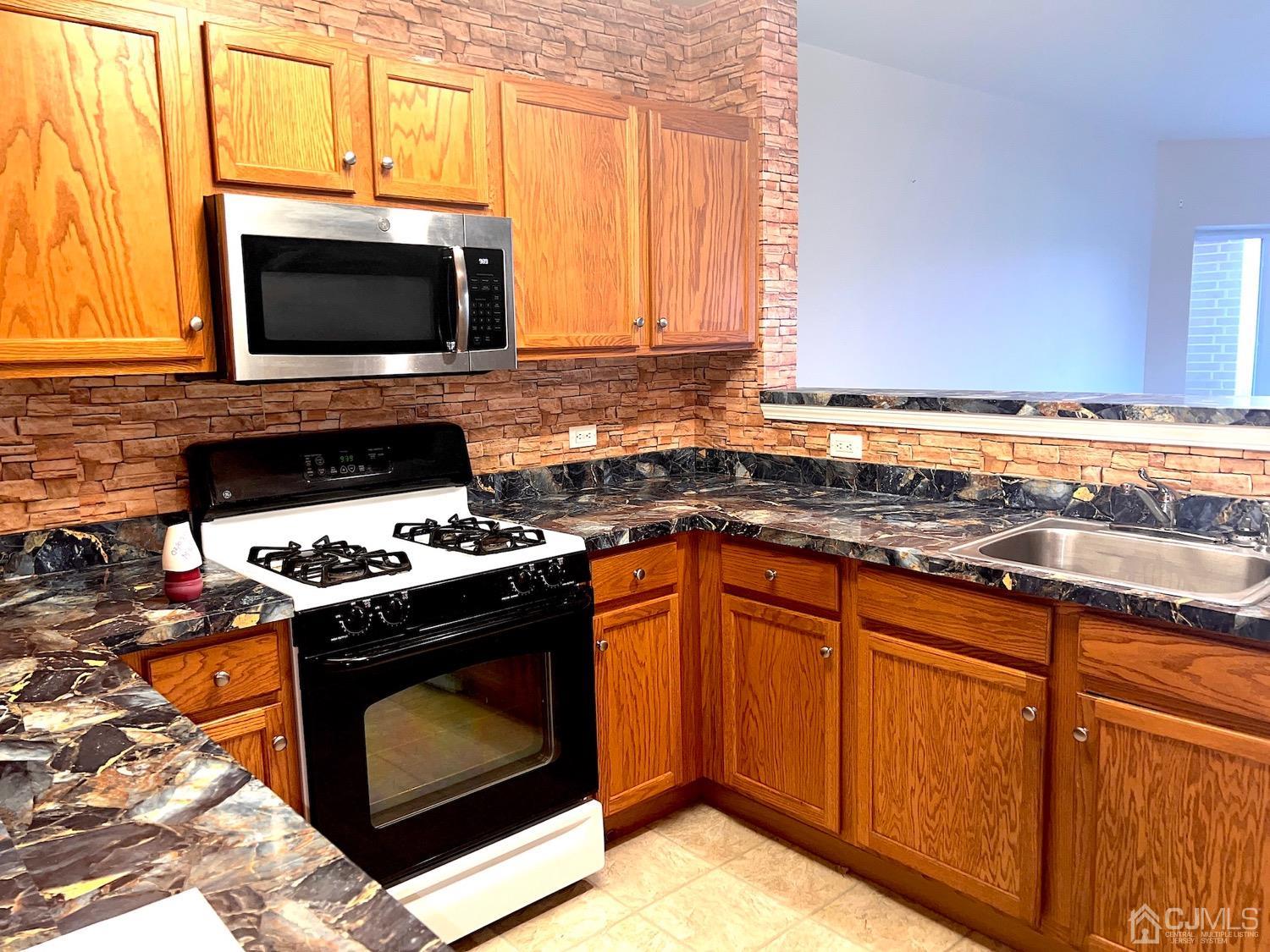 368 Rector Street, Unit 317 Perth Amboy, NJ 08861 - Photo 5 of 25 Kitchen area: Another angle view of the kitchen
