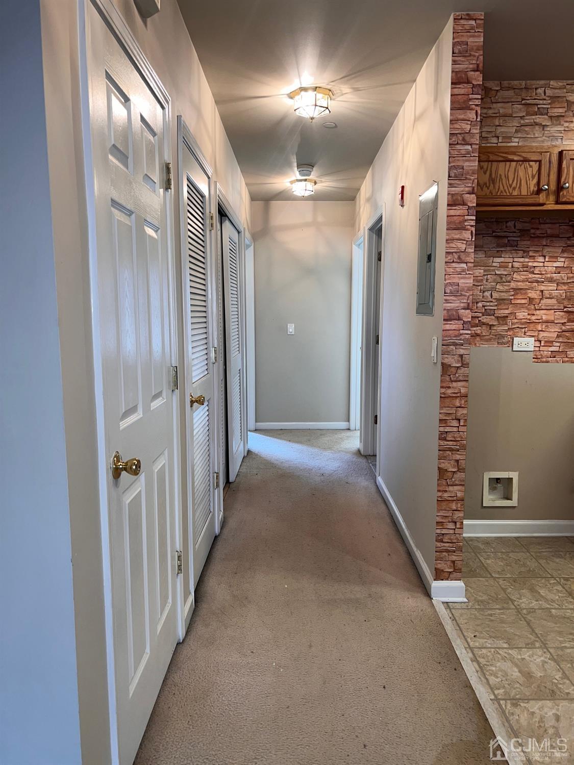 368 Rector Street, Unit 317 Perth Amboy, NJ 08861 - Photo 7 of 25 Foyer view: w/w carpeting with access to main bathroom, laundry area and 2 bedrooms in rear of the unit.