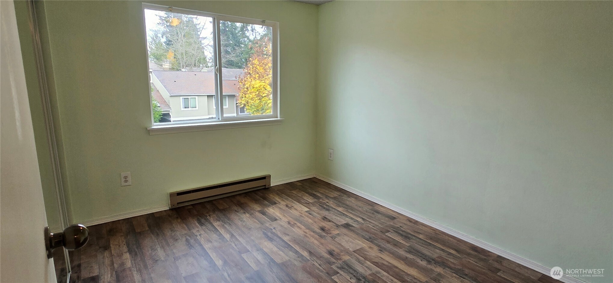 820 Cady Road, Unit H304 Everett, WA 98203 - Photo 14 of 28 an empty room with wooden floor and windows