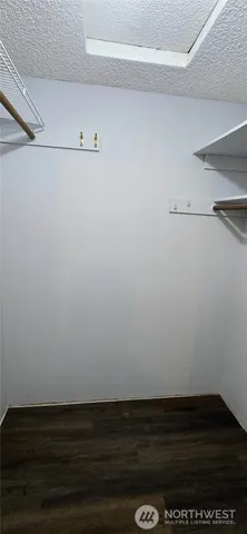 a view of an empty walk in closet