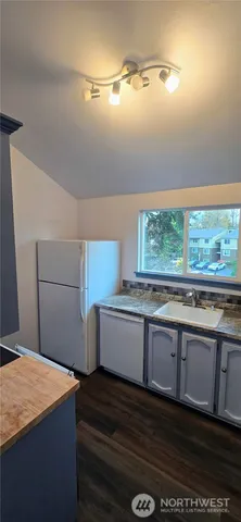 a kitchen that has a sink and a stove