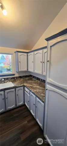 a kitchen with stainless steel appliances granite countertop a stove and a refrigerator