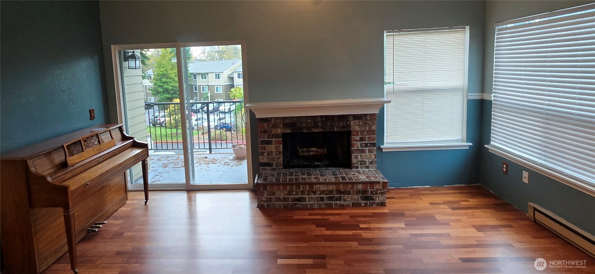 820 Cady Road, Unit H304 Everett, WA 98203 - Photo 7 of 28 a living room with furniture and a fireplace