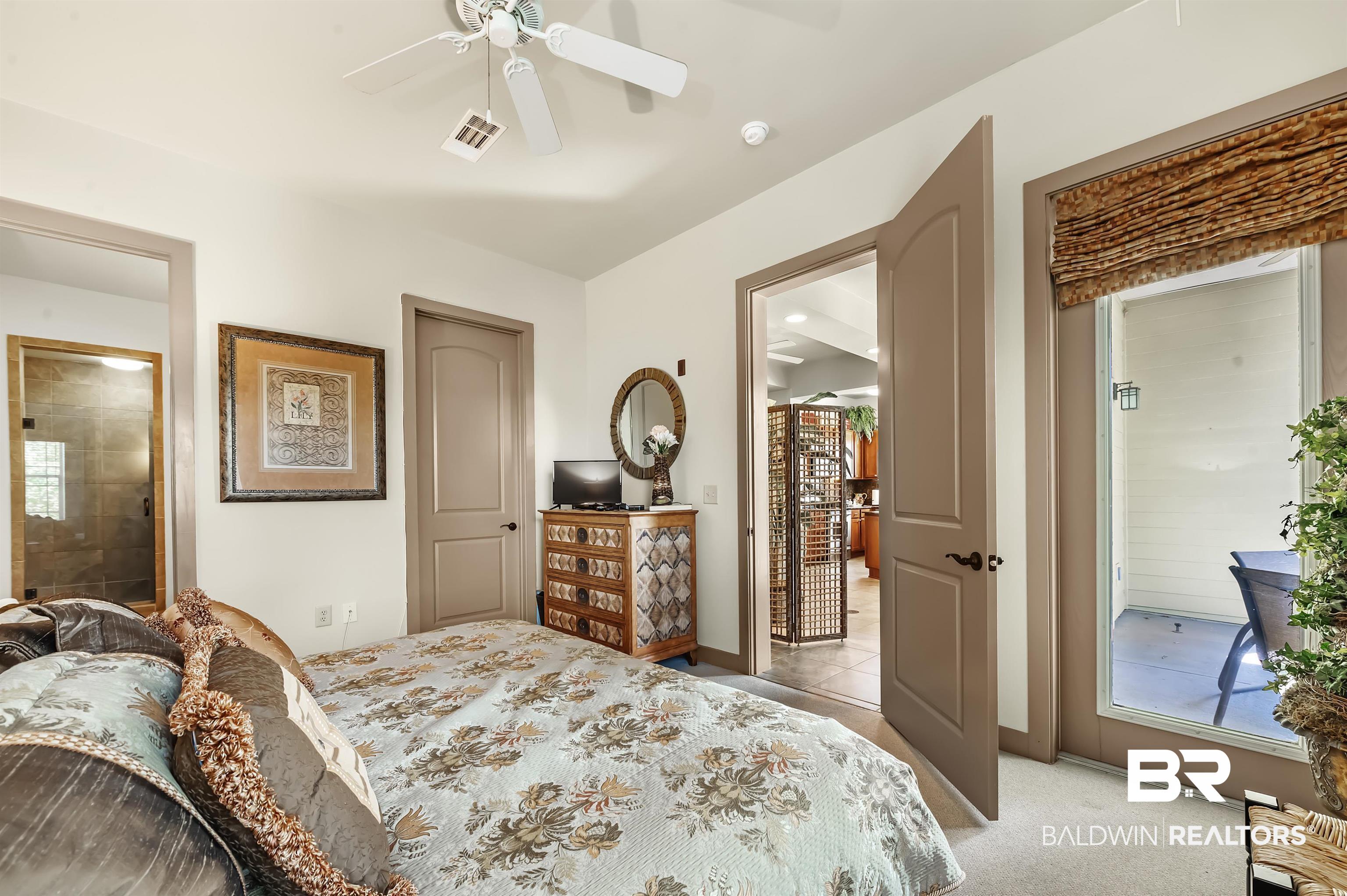 1430 Regency Road, Unit A301 Gulf Shores, AL 36542 - Photo 23 of 47 Bedroom featuring light colored carpet and ceiling fan