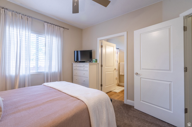 700 North Main Street, Unit F3 Washington, UT 84780 - Photo 16 of 34 Bedroom featuring a ceiling fan, a window with horizontal blinds, and neutral wall tones