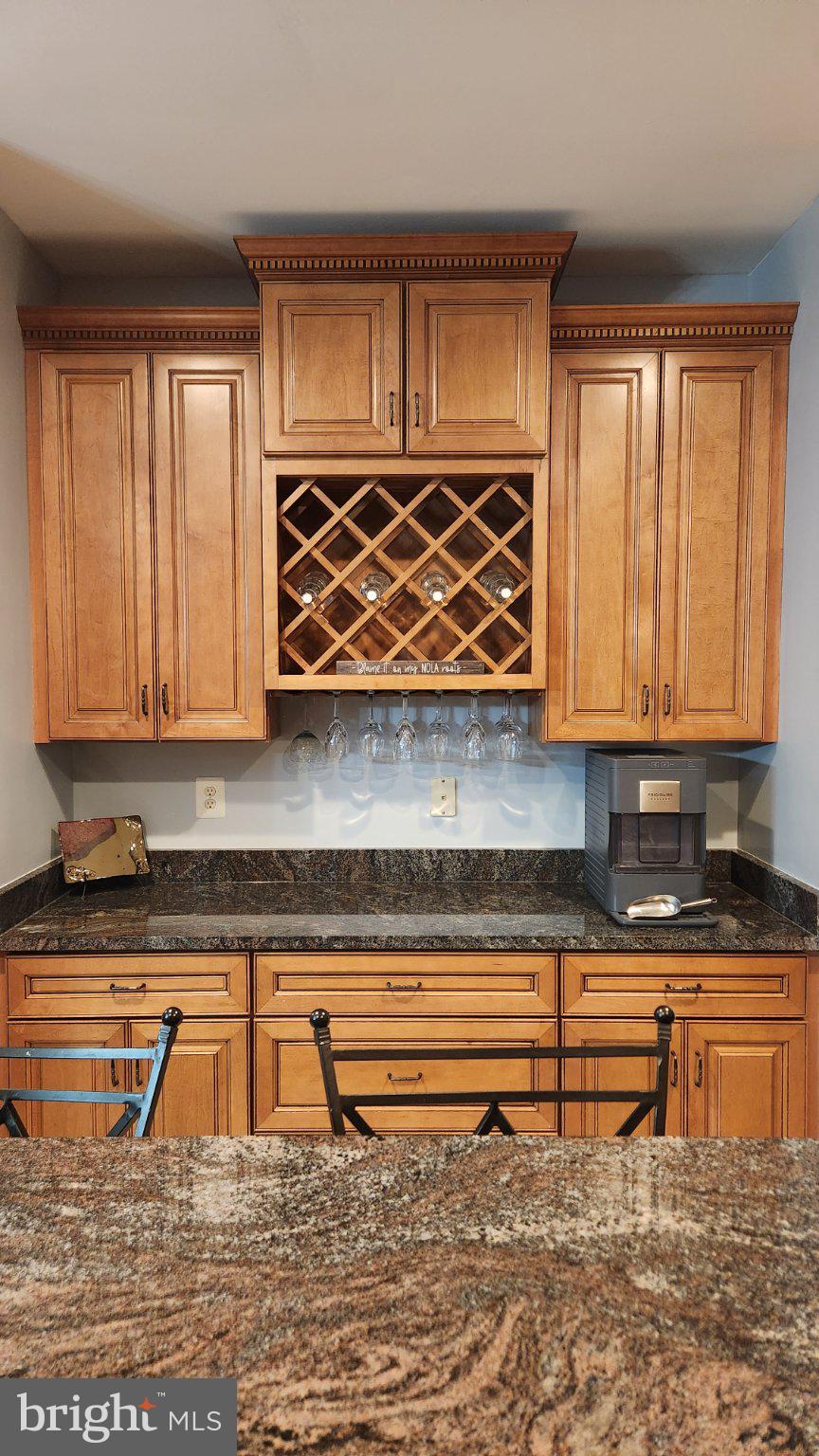 9855 McKinstry Mill Road New Windsor, MD 21776 - Photo 14 of 76 Elegant kitchen with rich wood accents.