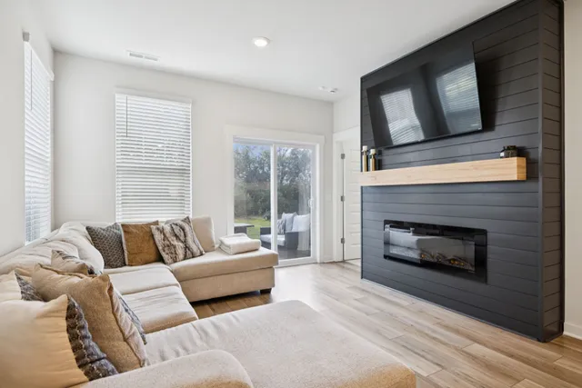 a living room with furniture and a fireplace
