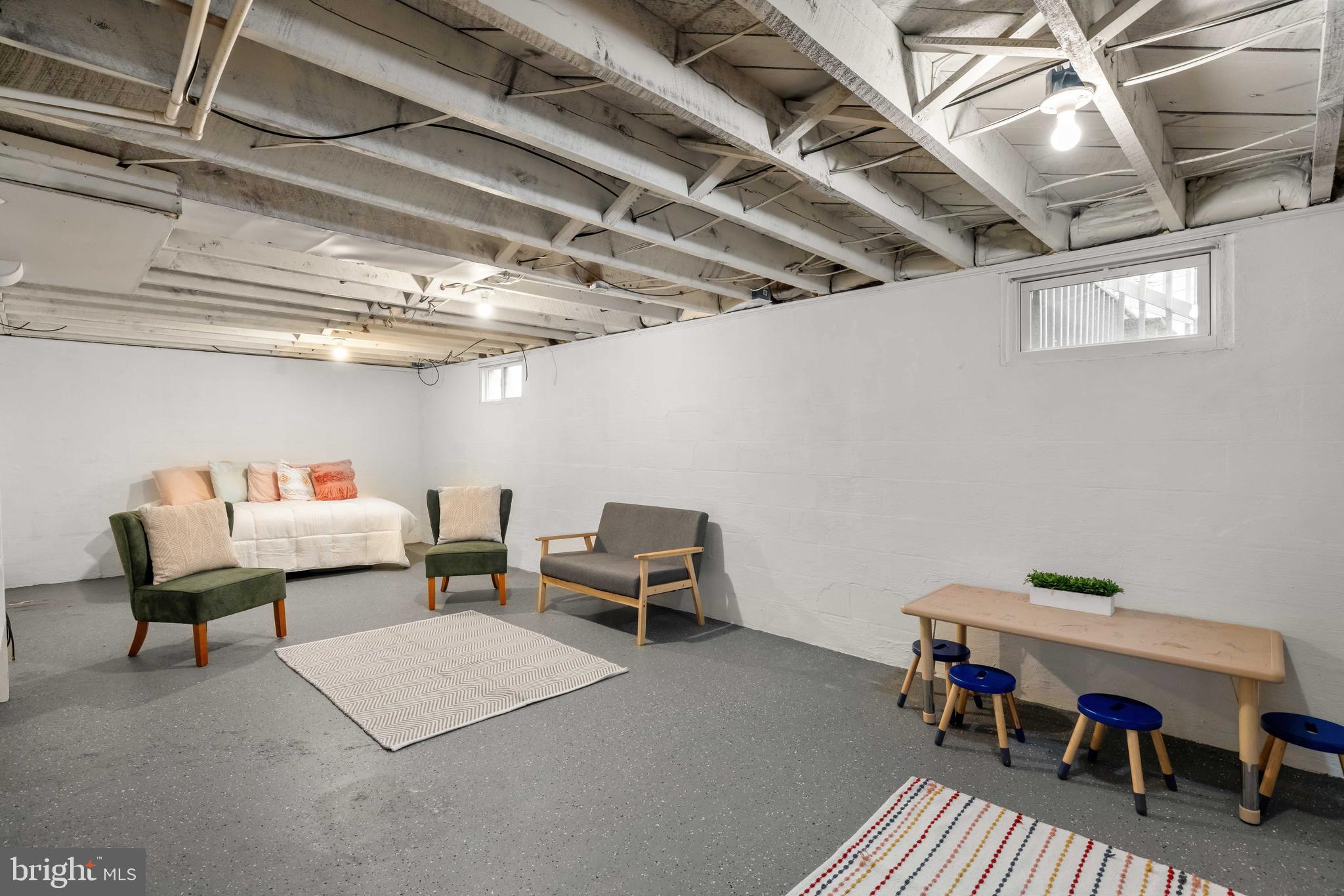 405 East 7th Avenue Ranson, WV 25438 - Photo 16 of 26 a reading room with furniture and a chandelier