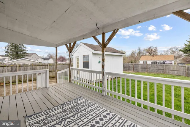 a view of a house with wooden deck