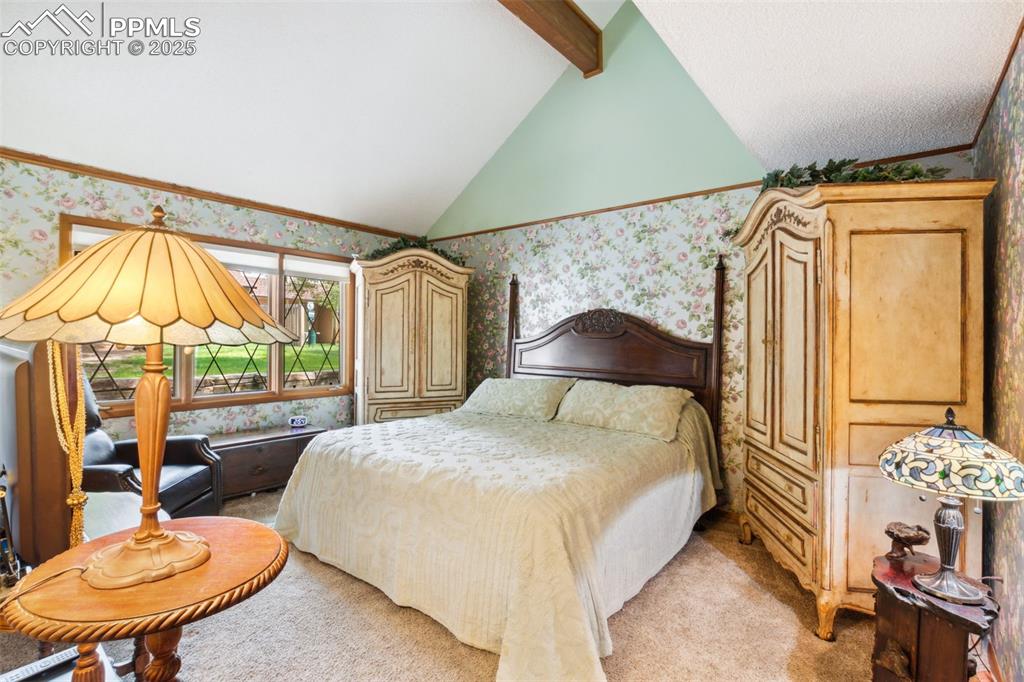 4835 Castledown Road Colorado Springs, CO 80917 - Photo 11 of 29 a bedroom with a bed and a chair