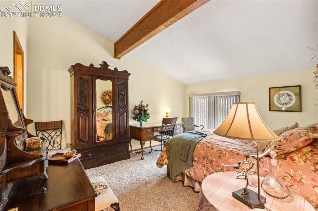 4835 Castledown Road Colorado Springs, CO 80917 - Photo 14 of 29 a bed room with a bed and a chair