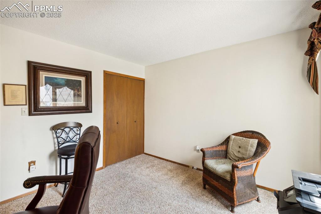 4835 Castledown Road Colorado Springs, CO 80917 - Photo 19 of 29 a view of a workspace with furniture and a window