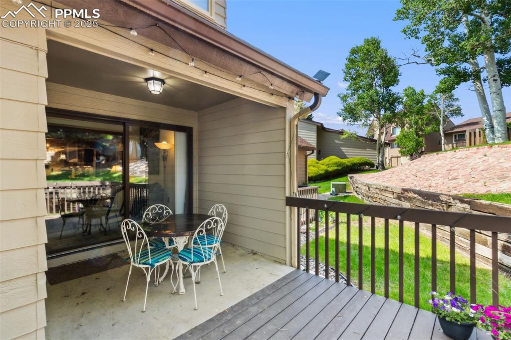 4835 Castledown Road Colorado Springs, CO 80917 - Photo 21 of 29 a view of a patio with a table and chairs