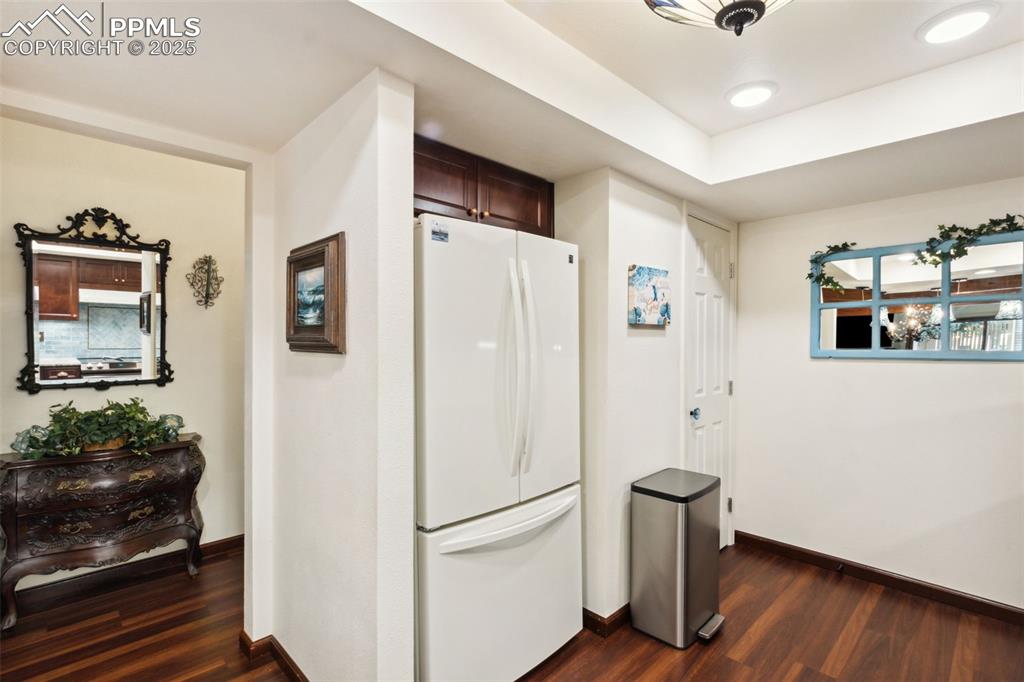 4835 Castledown Road Colorado Springs, CO 80917 - Photo 7 of 29 a white refrigerator freezer sitting inside of a kitchen