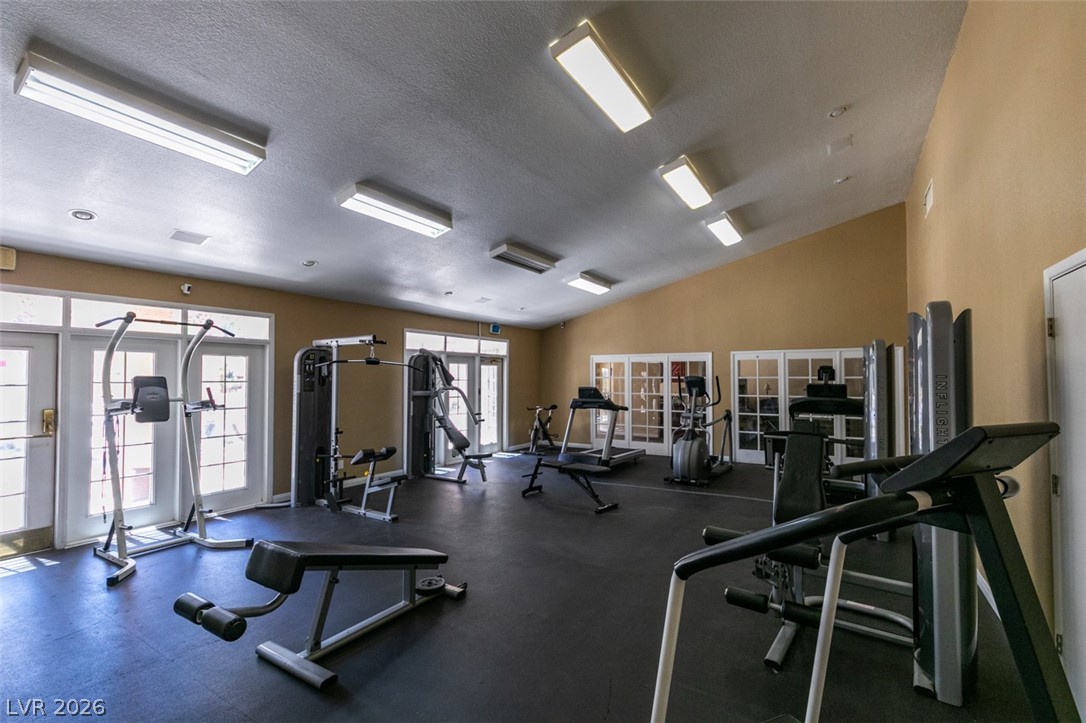 9325 West Desert Inn Road, Unit 244 Las Vegas, NV 89117 - Photo 41 of 55 An inviting fitness center boasts ample space and diverse exercise equipment for resident workouts.