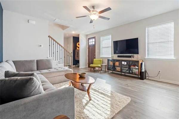 a living room with furniture and a flat screen tv