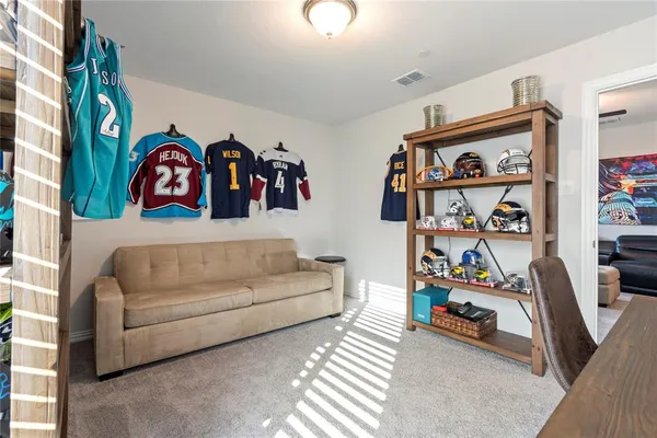 a living room with lots of baby furniture and decor