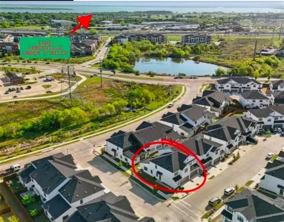 an aerial view of a house with a ocean view