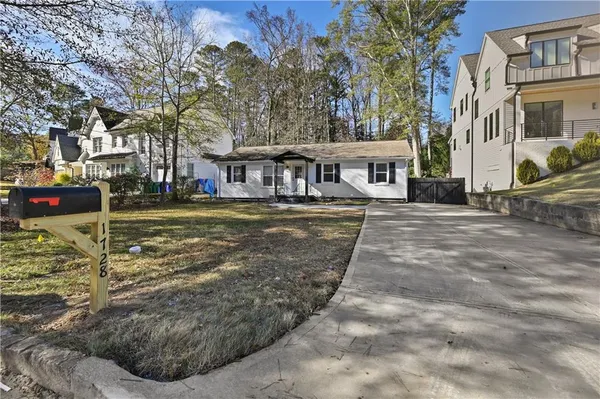 a view of a town with brick building and large trees