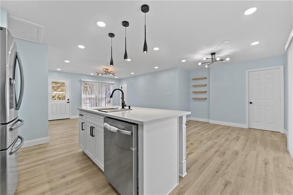 1728 Wayland Circle Northeast Brookhaven, GA 30319 - Photo 13 of 31 a kitchen with kitchen island a sink stainless steel appliances and cabinets