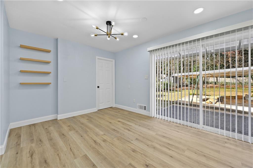 1728 Wayland Circle Northeast Brookhaven, GA 30319 - Photo 14 of 31 wooden floor in an empty room with a window