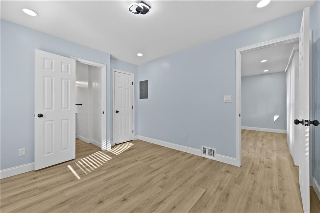 1728 Wayland Circle Northeast Brookhaven, GA 30319 - Photo 17 of 31 wooden floor in an empty room with a window