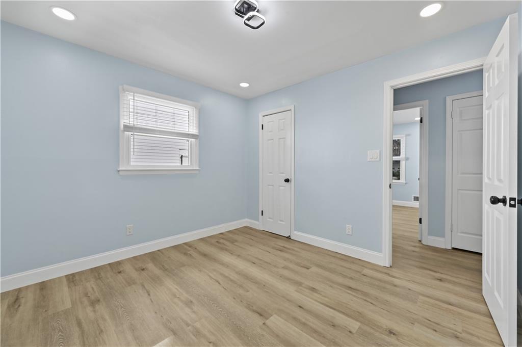 1728 Wayland Circle Northeast Brookhaven, GA 30319 - Photo 23 of 31 a view of an empty room with wooden floor and a window