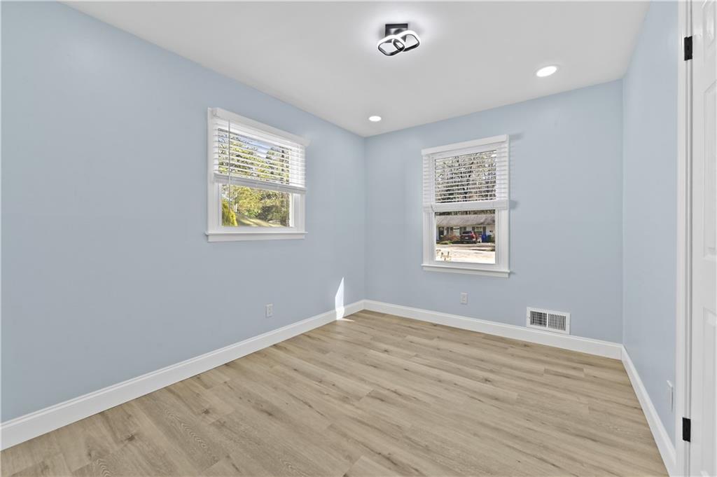 1728 Wayland Circle Northeast Brookhaven, GA 30319 - Photo 24 of 31 a view of room with window and wooden floor