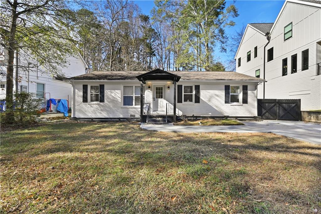 1728 Wayland Circle Northeast Brookhaven, GA 30319 - Photo 3 of 31 a front view of a house with a yard