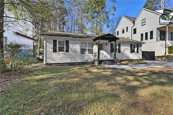 a front view of a house with a yard