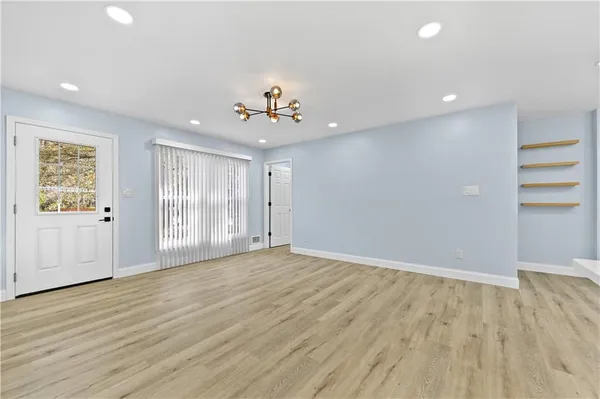 a view of an empty room with a window