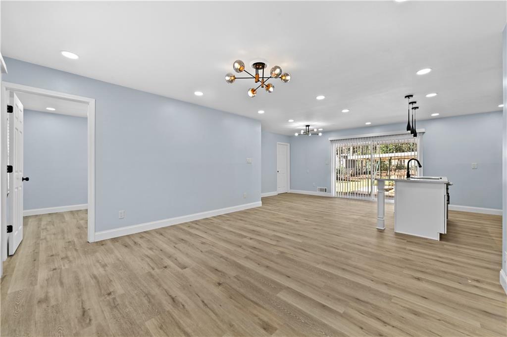 1728 Wayland Circle Northeast Brookhaven, GA 30319 - Photo 8 of 31 a view of a living room and kitchen with wooden floor