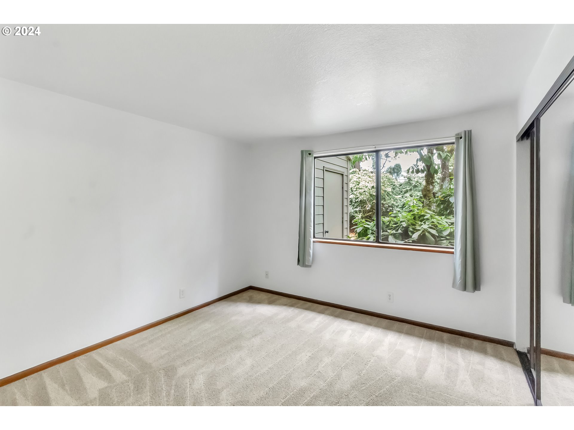 2051 Lake Isle Terrace Eugene, OR 97401 - Photo 12 of 36 a view of an empty room with a window