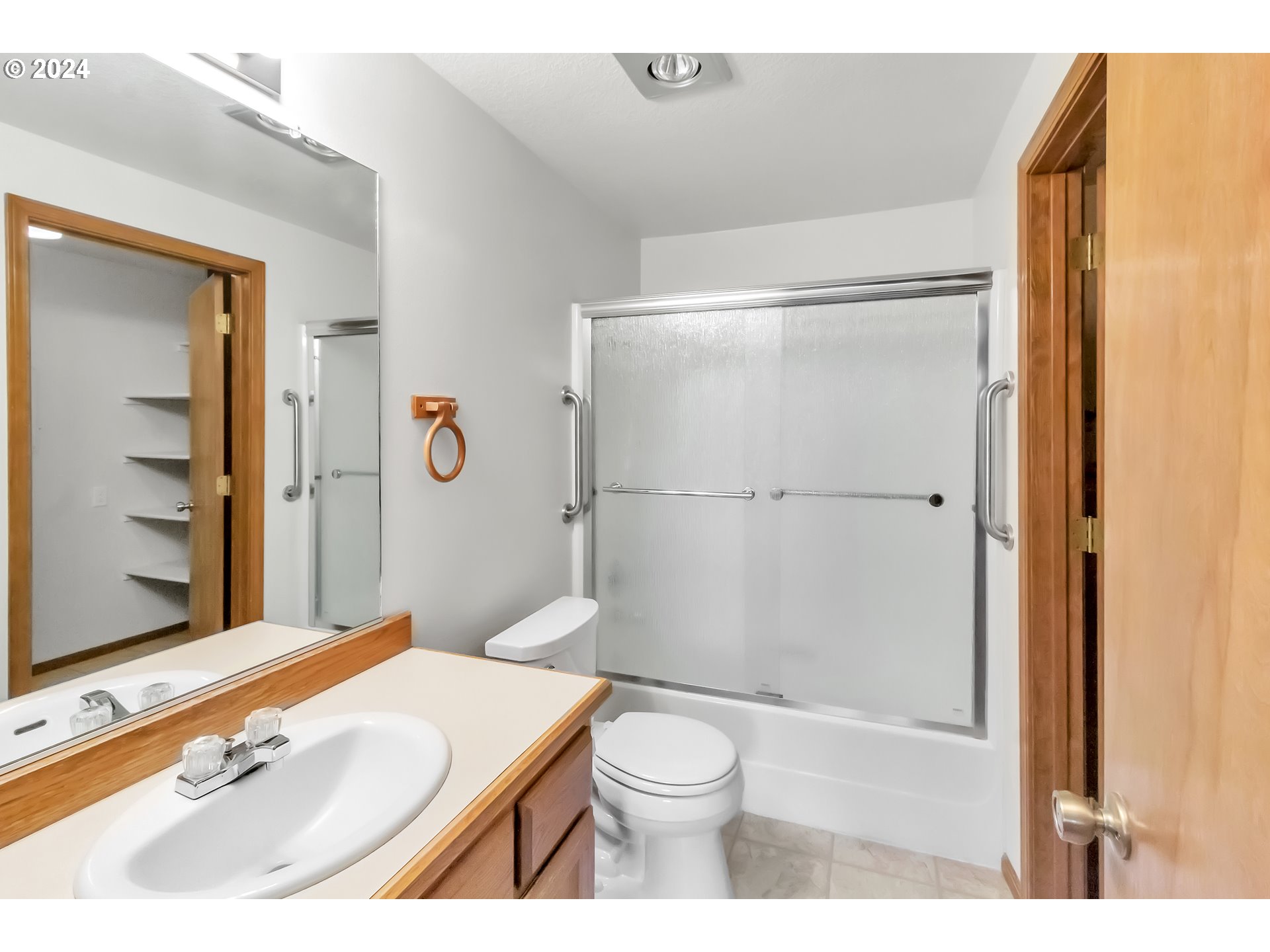 2051 Lake Isle Terrace Eugene, OR 97401 - Photo 14 of 36 a bathroom with a sink a toilet and shower