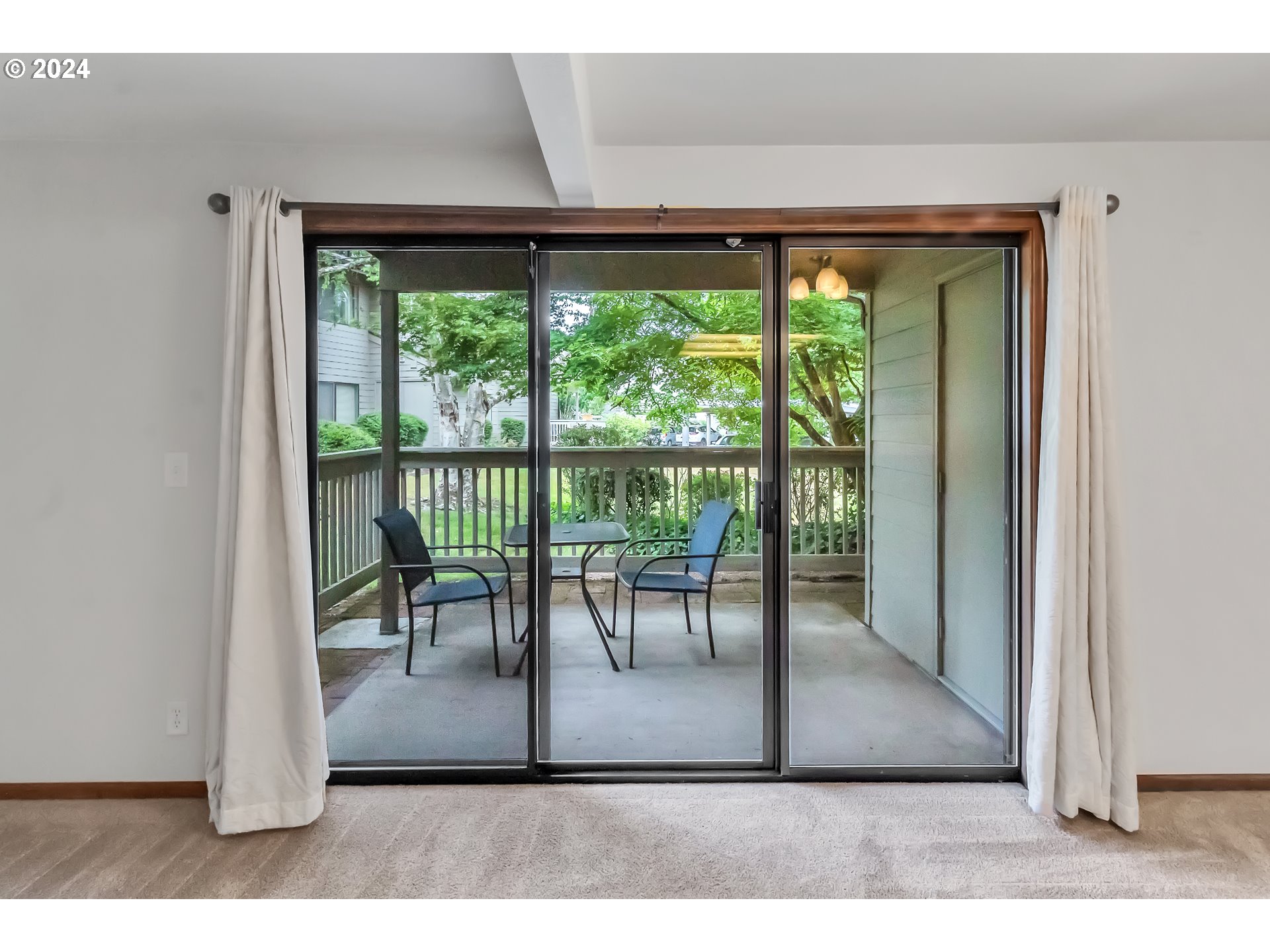 2051 Lake Isle Terrace Eugene, OR 97401 - Photo 20 of 36 a view of a porch with a table and chairs