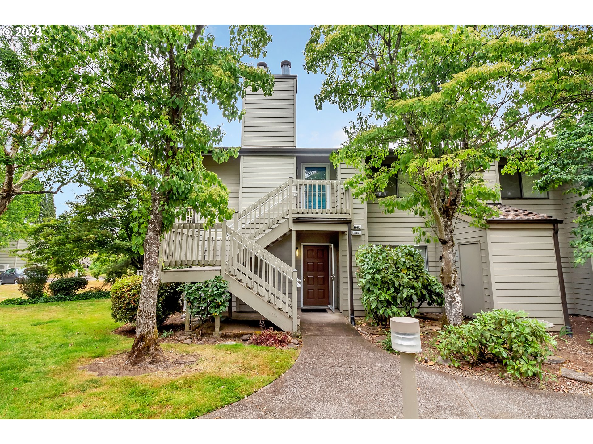 2051 Lake Isle Terrace Eugene, OR 97401 - Photo 2 of 36 a view of a house with backyard and sitting area