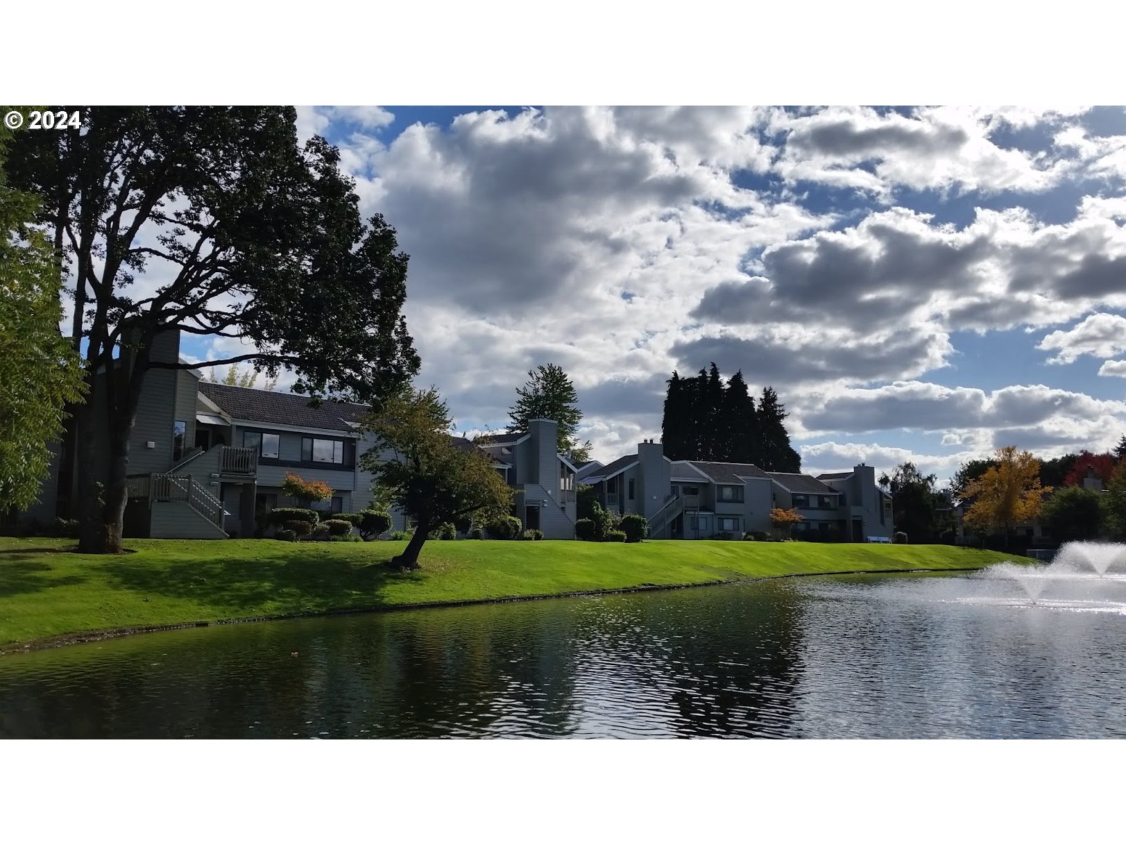 2051 Lake Isle Terrace Eugene, OR 97401 - Photo 26 of 36 a view of a garden with a building