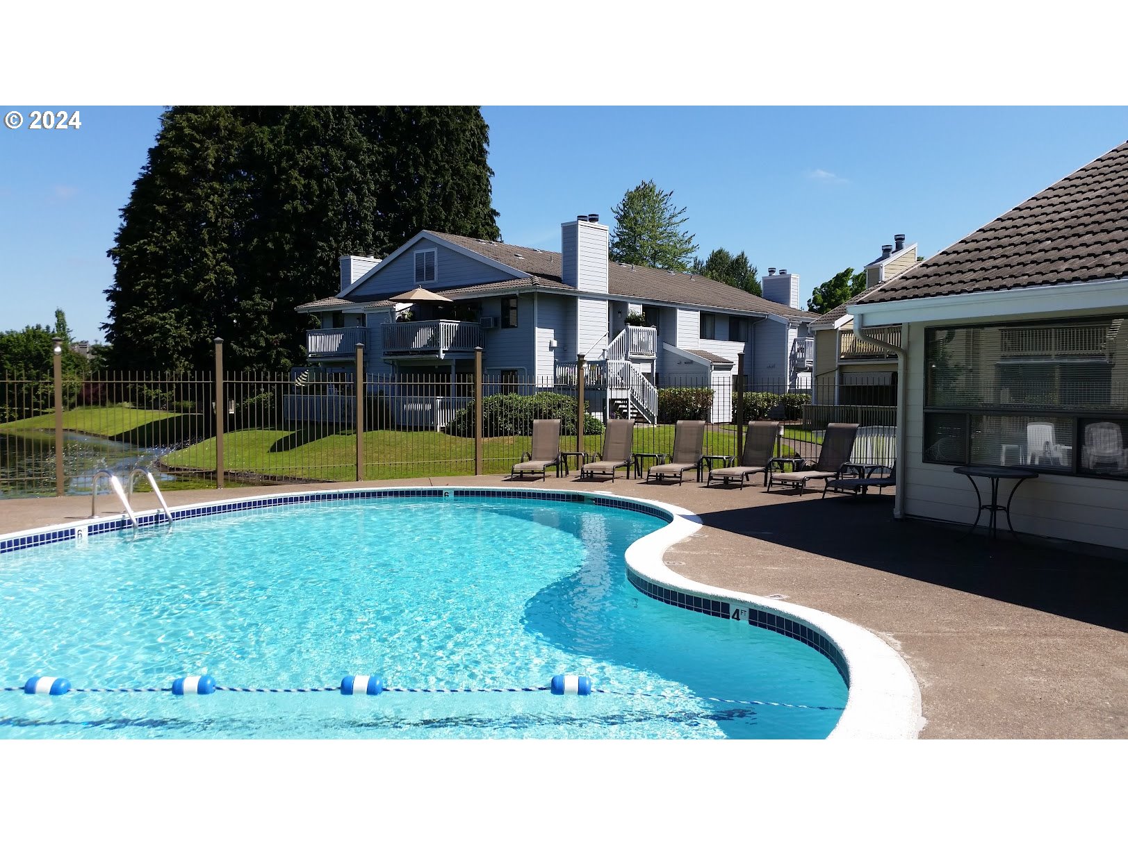 2051 Lake Isle Terrace Eugene, OR 97401 - Photo 31 of 36 a view of a house with swimming pool and sitting area